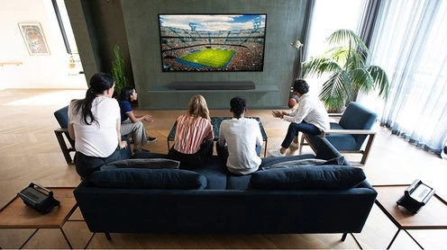 Family watching a large 4K Television